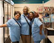 three african american woman posing for a picture in the Food Pantries at Senior Communities